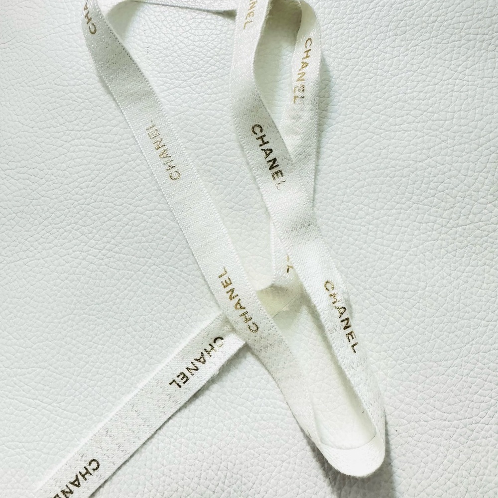 Chanel White Ribbon w gold font limited edition for holiday